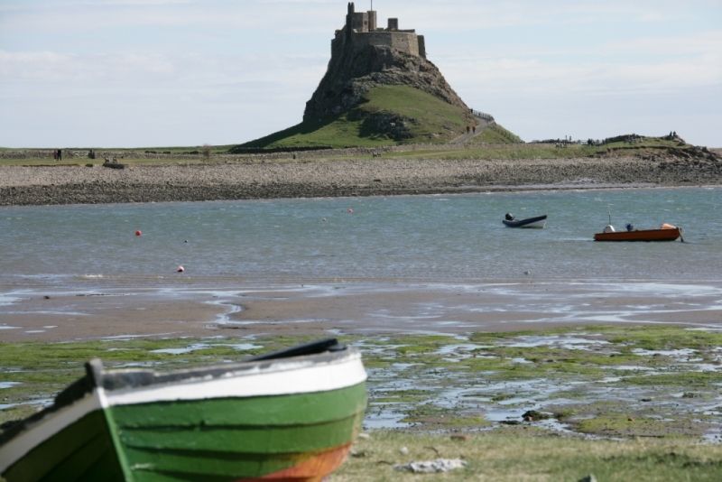 Lindisfarne Castle with boats in foreground