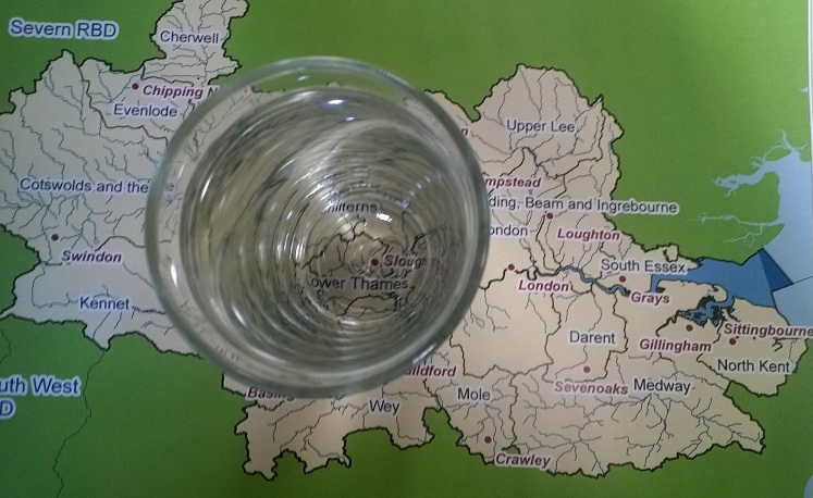 Photo of glass of water on map of Thames RBD to illustrate the concept of groundwater